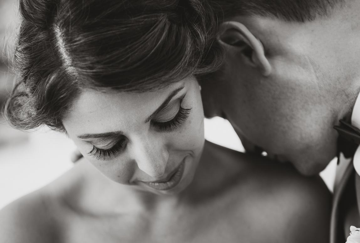 after wedding photograoger in mallorca created stunning portraits - husband kisses wife on the shoulders
