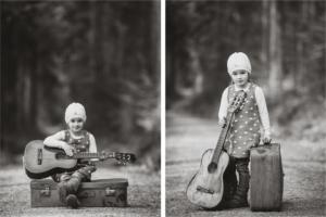 mallorca kids adventure photographer - toddler holding a guitar and luggage in b&w