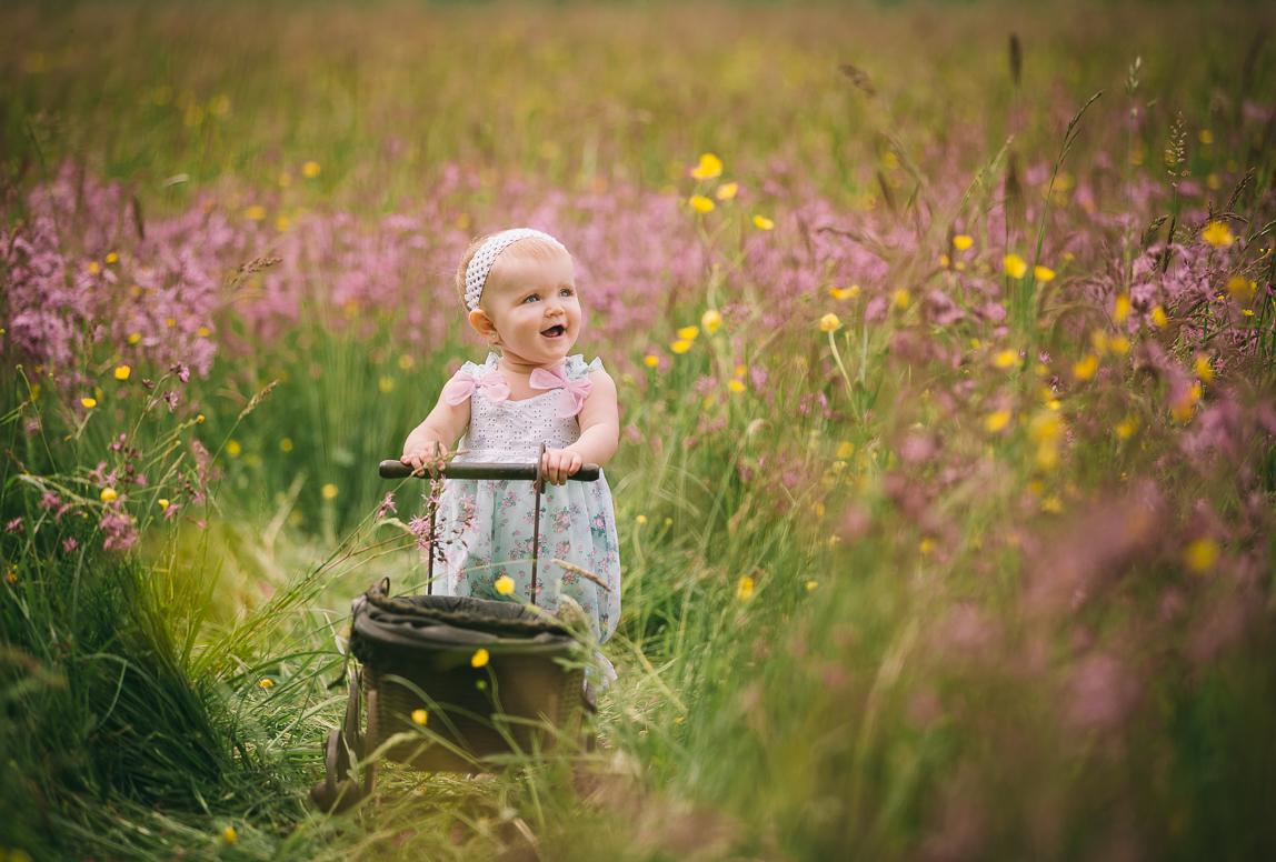 mallorca kids portrait photoshoot - cute portrait of a baby with the flowers