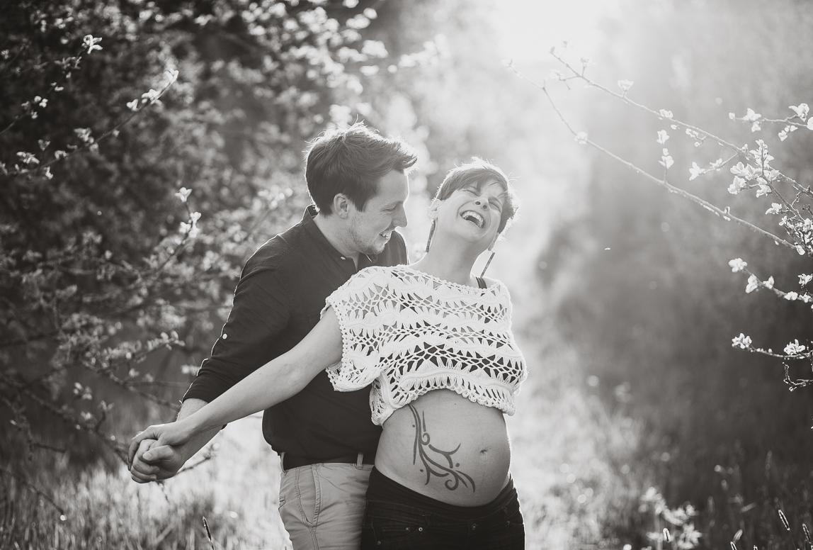 mallorca maternity photoshoot - lovers looking happy and inlove