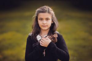 mallorca portrait photography - little girl holding a chicken
