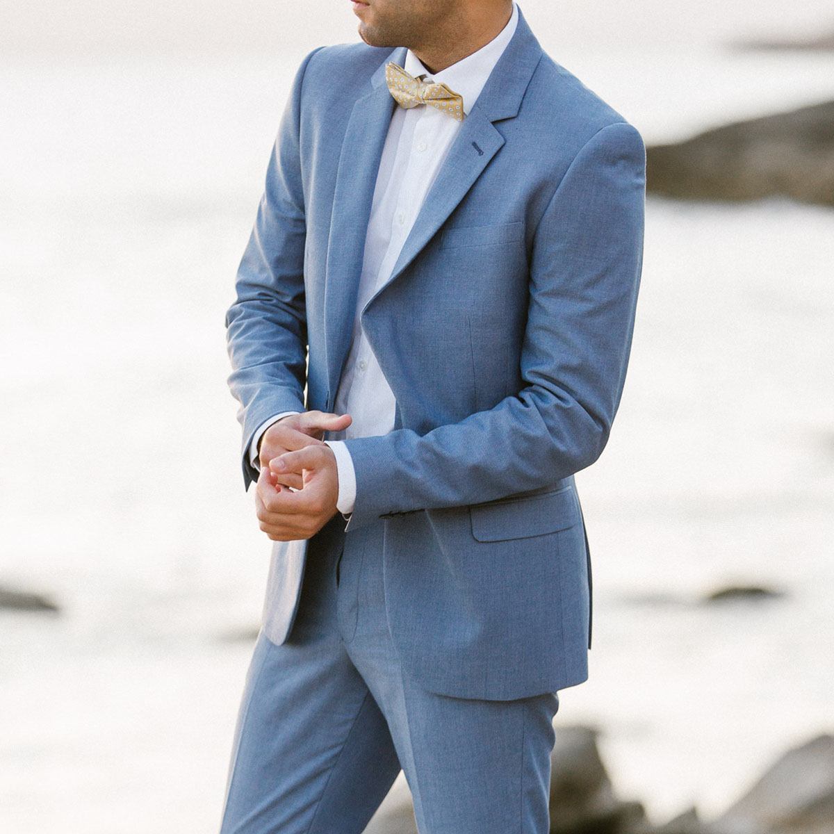 groom on his blue suit boho wedding