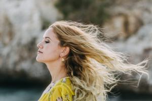 beautiful woman with hair flying in the wind - photo by portrait photographer cala d Or - Mallorca
