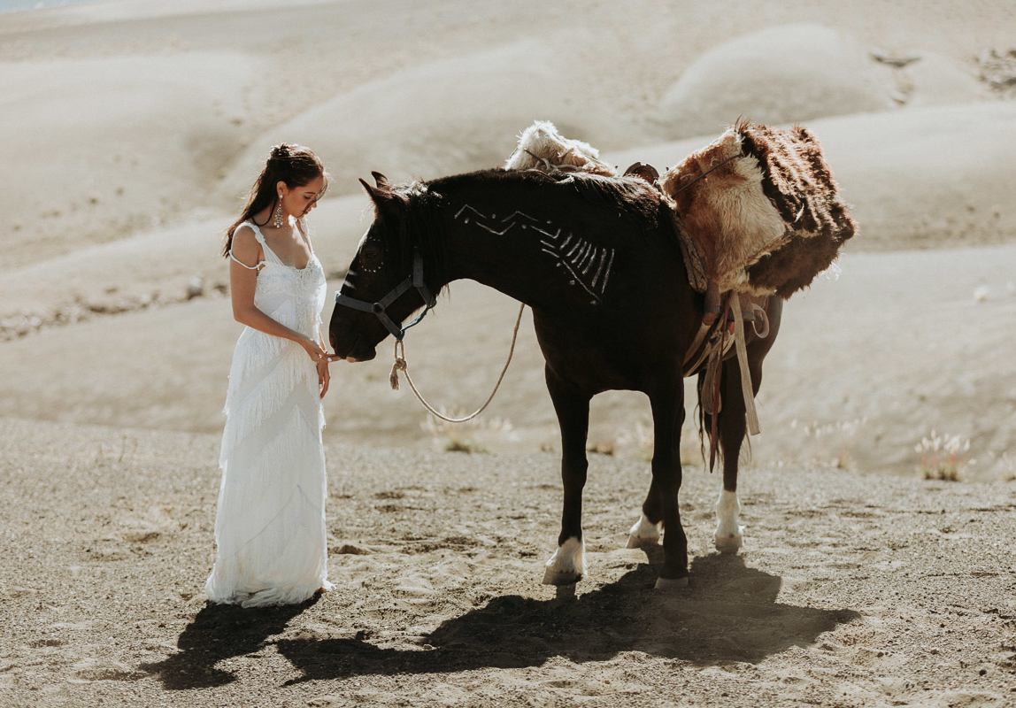 photographer in Chile: bride with horse in the pristine wilderness of the Chilean mountains
