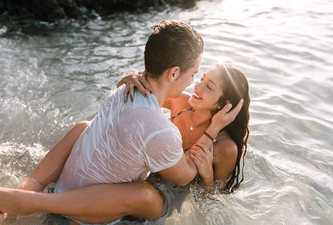 Mallorca photographer Romany Flowers photographs couple in the water during their engagement photo session